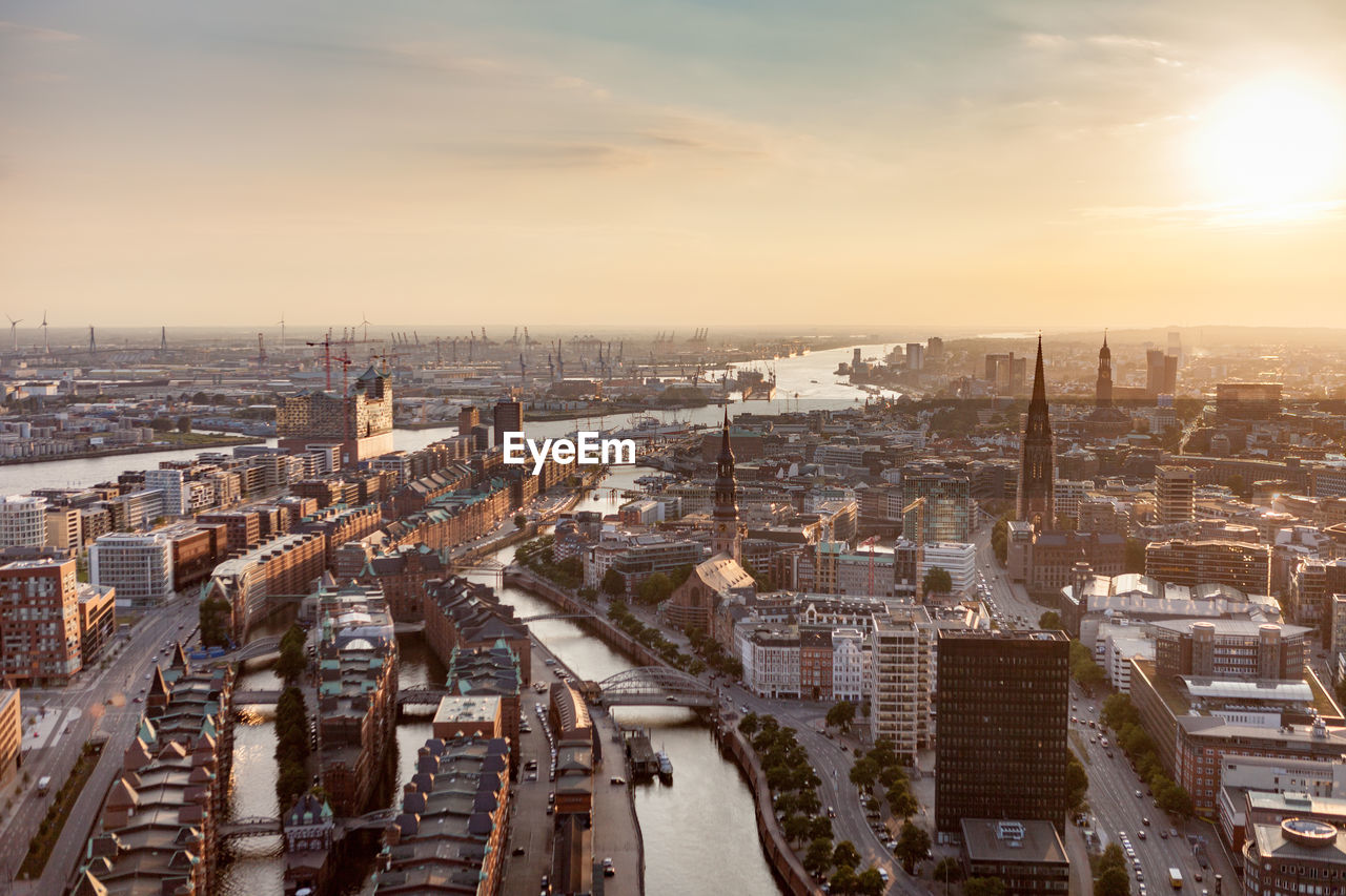 High angle view of city at sunset