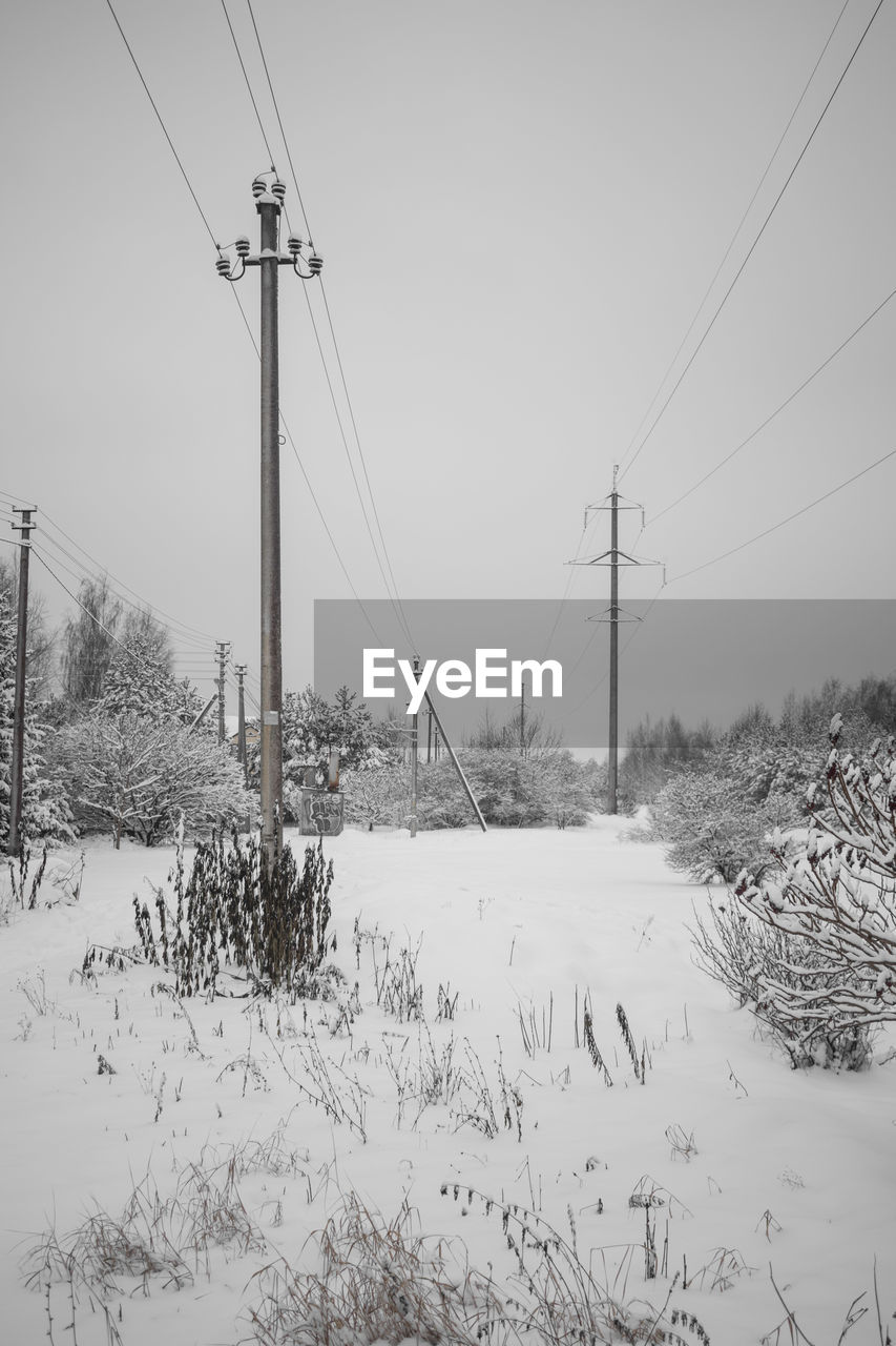 SKI LIFT ON FIELD AGAINST CLEAR SKY