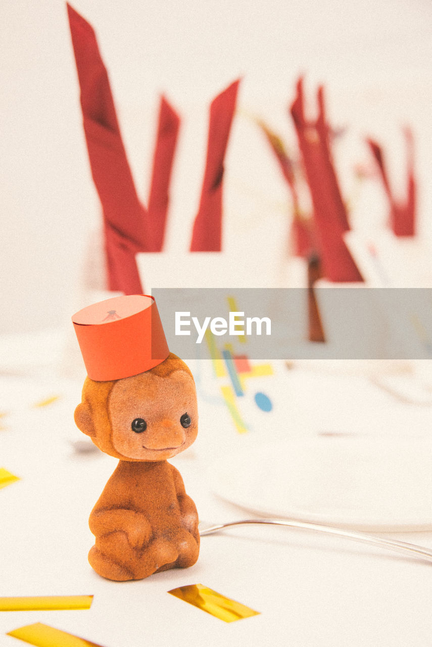 Close-up of toy monkey on table
