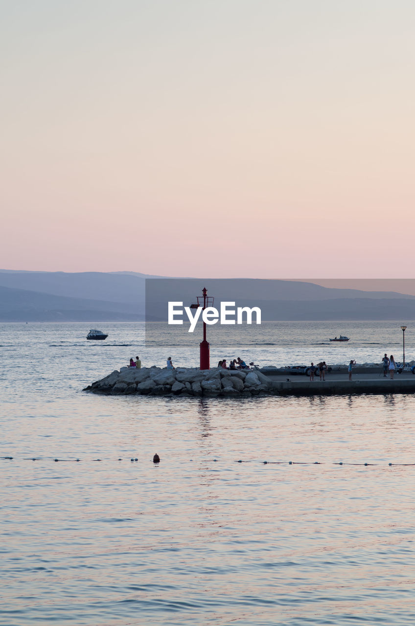 SCENIC VIEW OF SEA DURING SUNSET