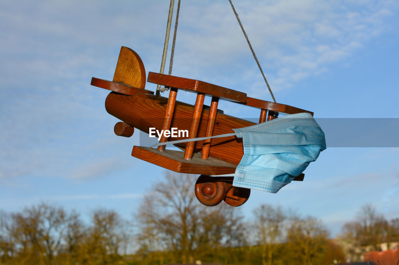 LOW ANGLE VIEW OF KITES AGAINST SKY