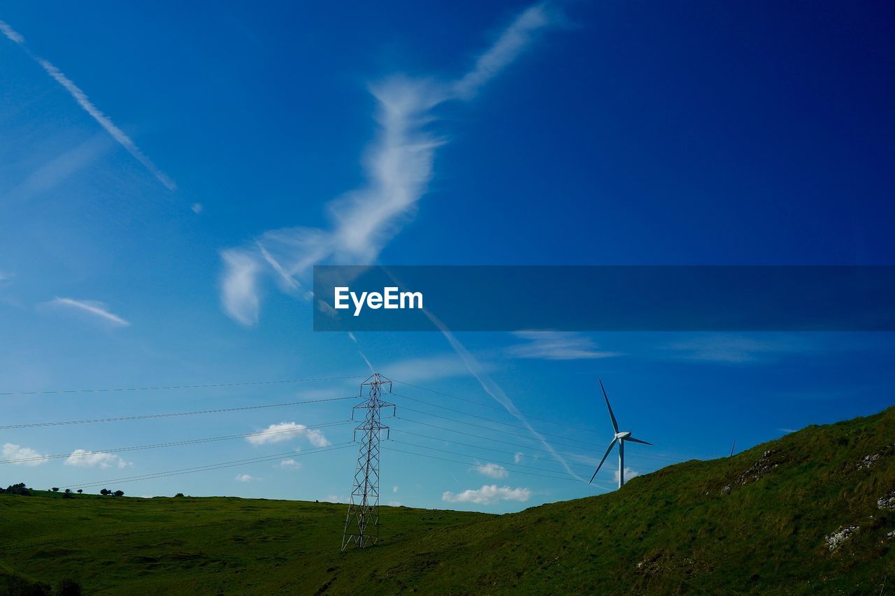 LOW ANGLE VIEW OF VAPOR TRAILS AGAINST SKY