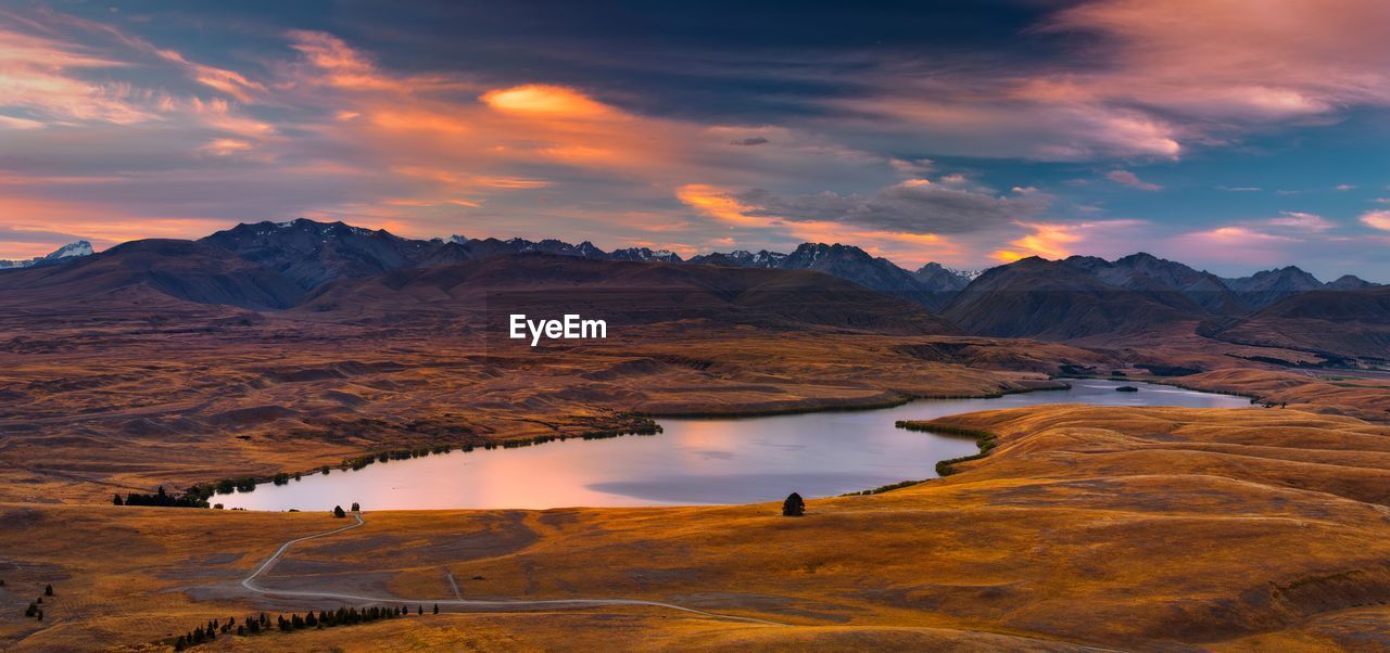 Scenic view of lake against sky during sunset