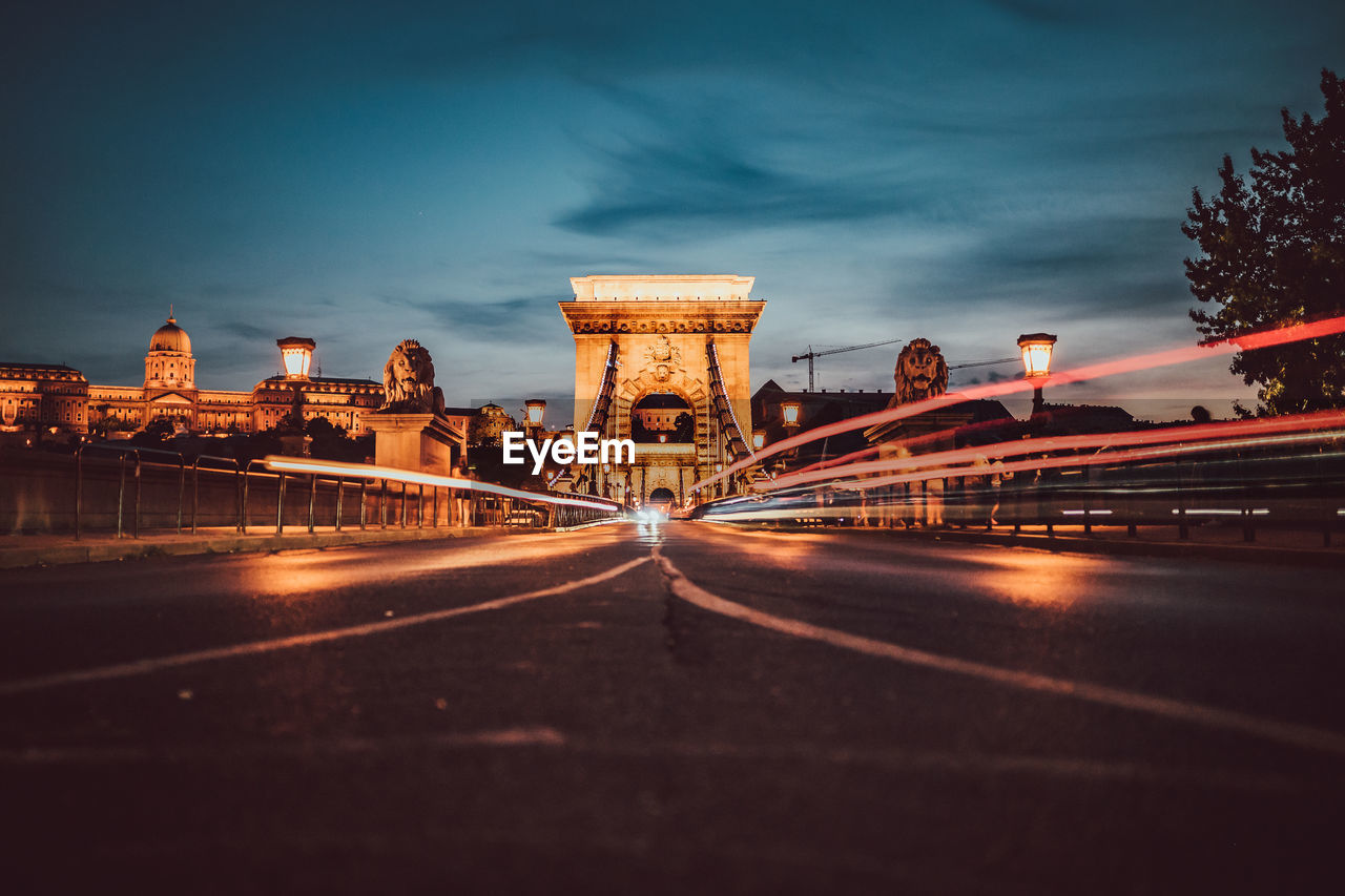 Light trails on suspension bridge at night