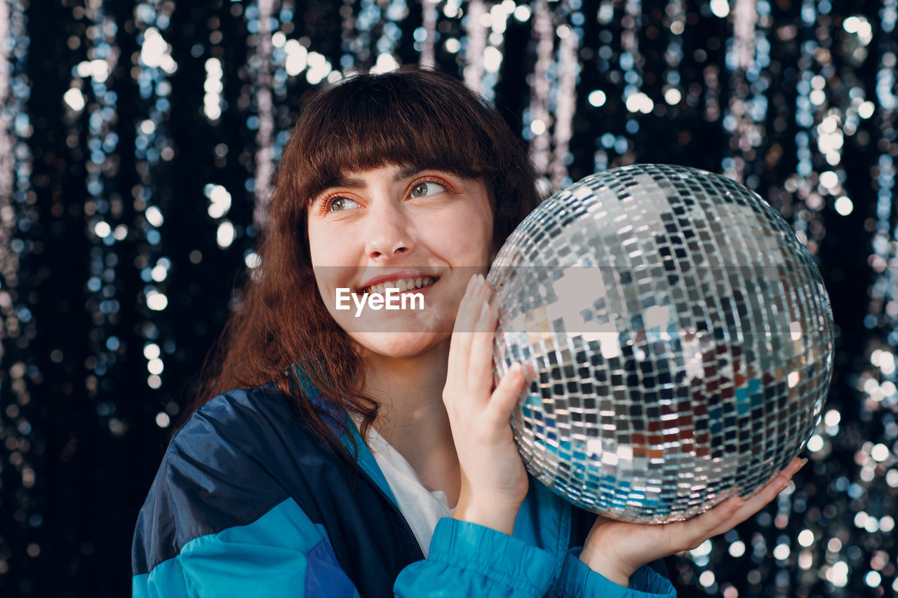 portrait of woman holding crystal