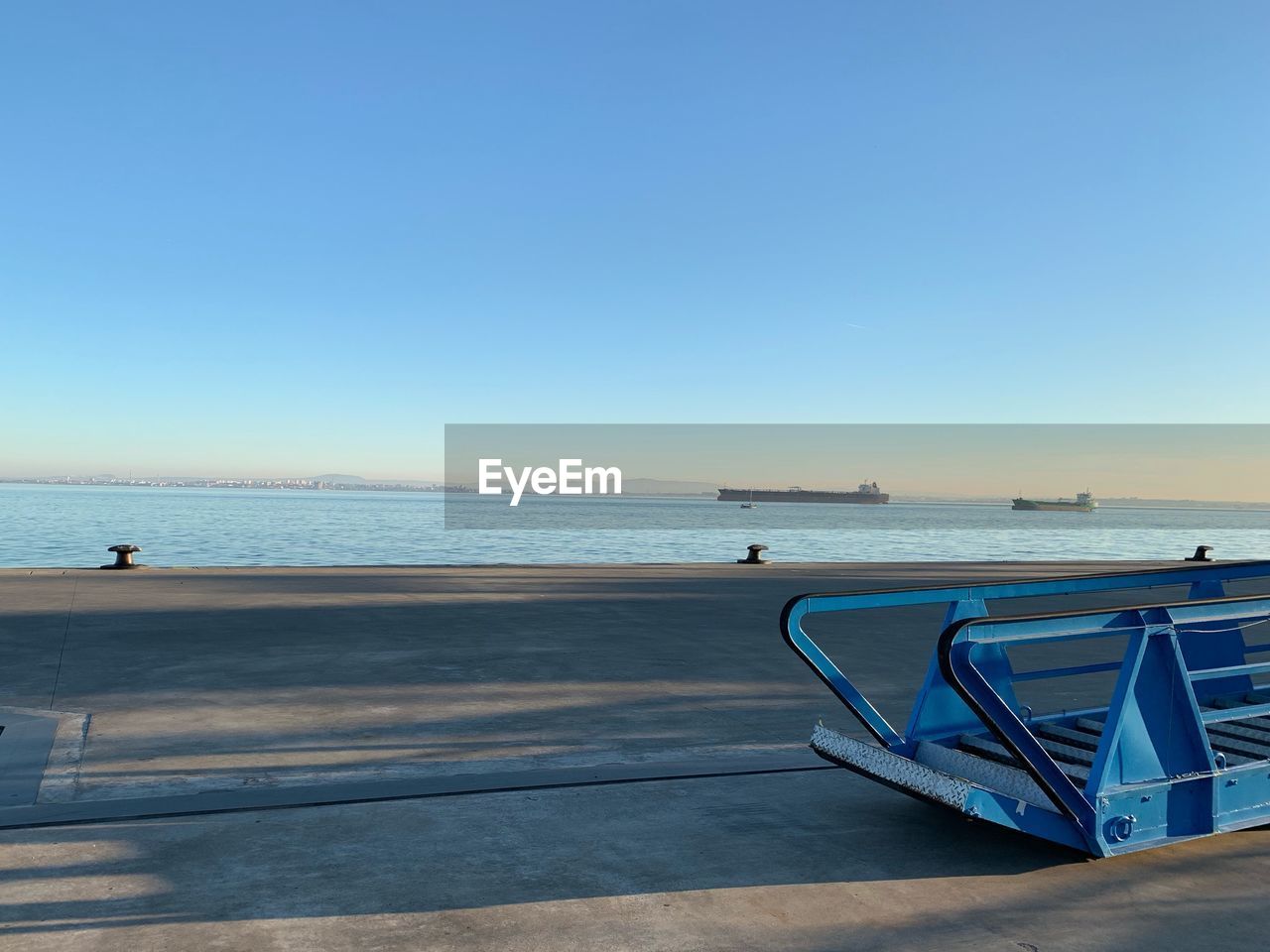 SCENIC VIEW OF BEACH AGAINST CLEAR BLUE SKY