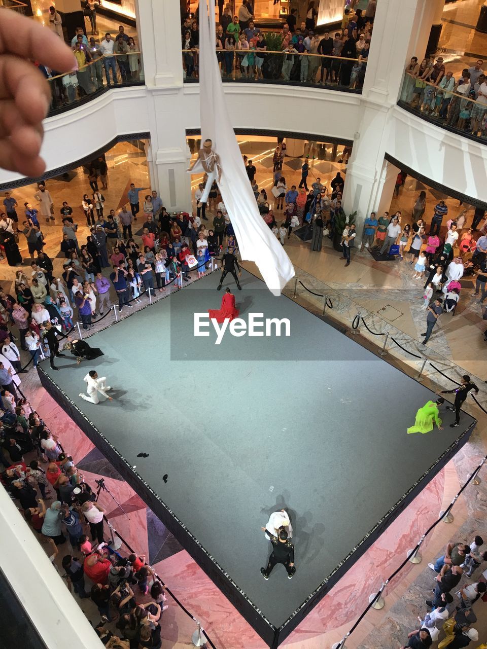 HIGH ANGLE VIEW OF PEOPLE ON SHOPPING MALL