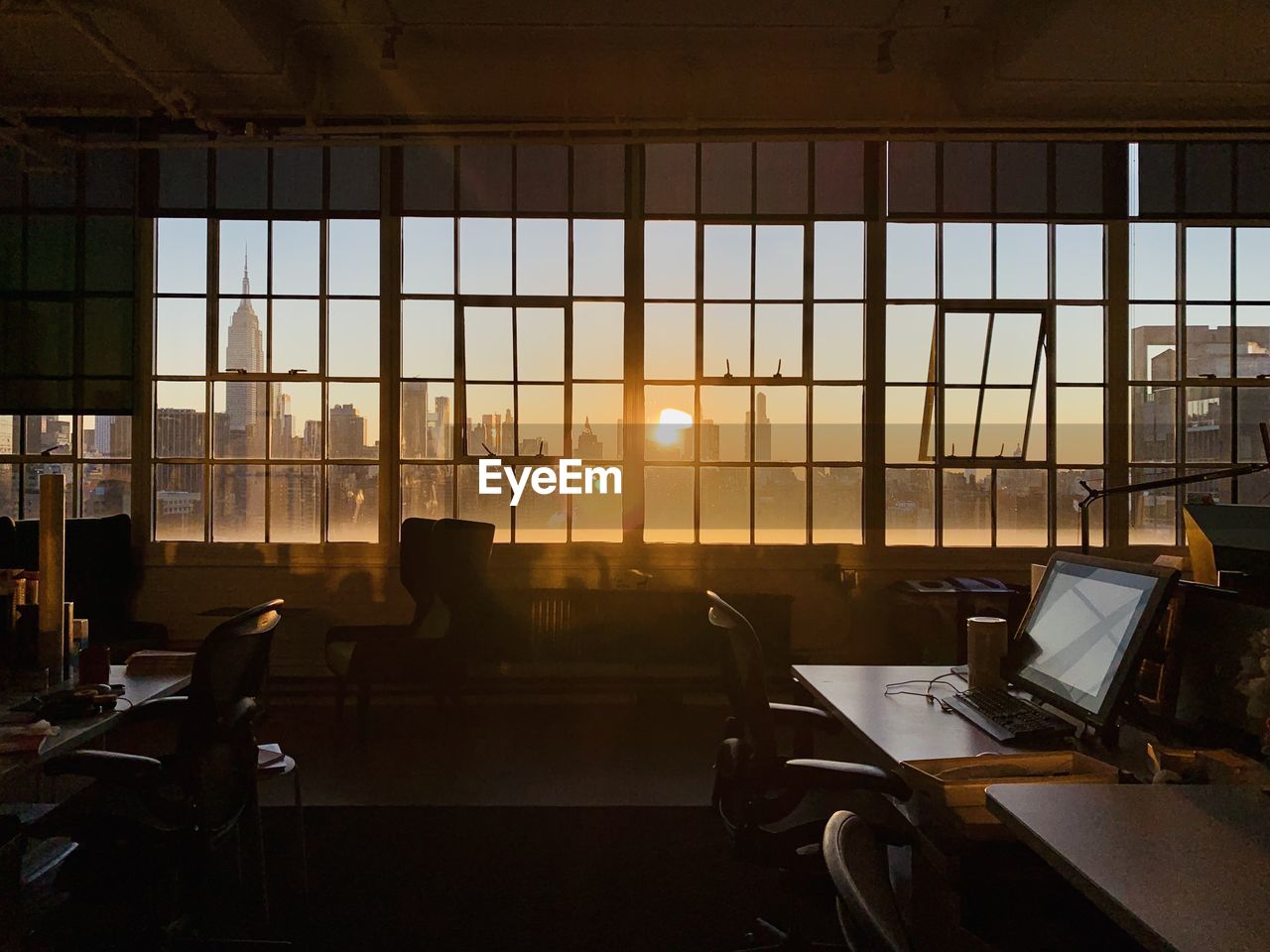 Sunrise view of new york city through industrial window front