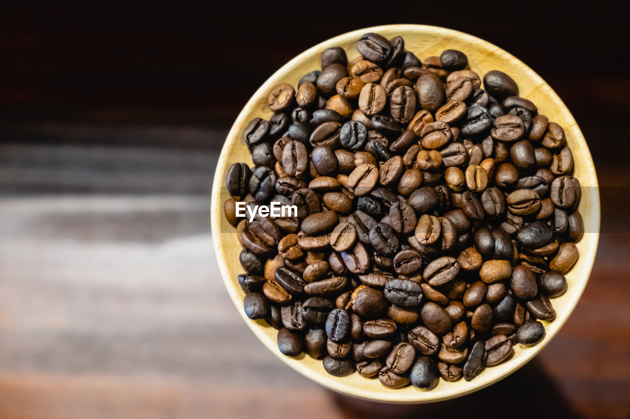 CLOSE-UP OF COFFEE BEANS IN GLASS