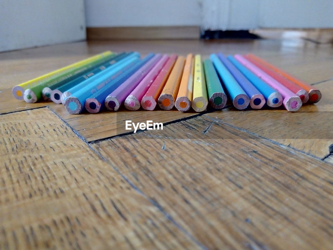 CLOSE-UP OF PENCILS ON TABLE