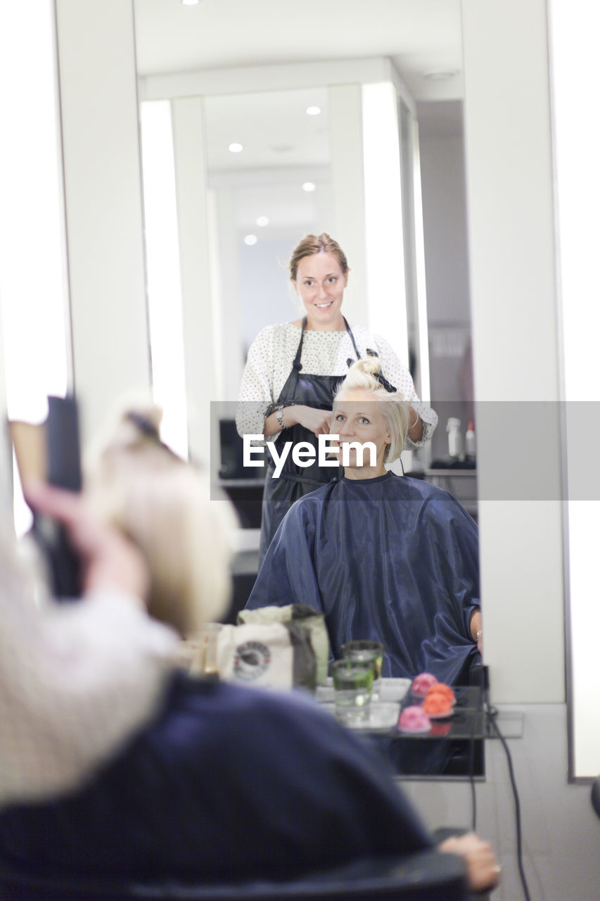 Woman having haircut, stockholm, sweden
