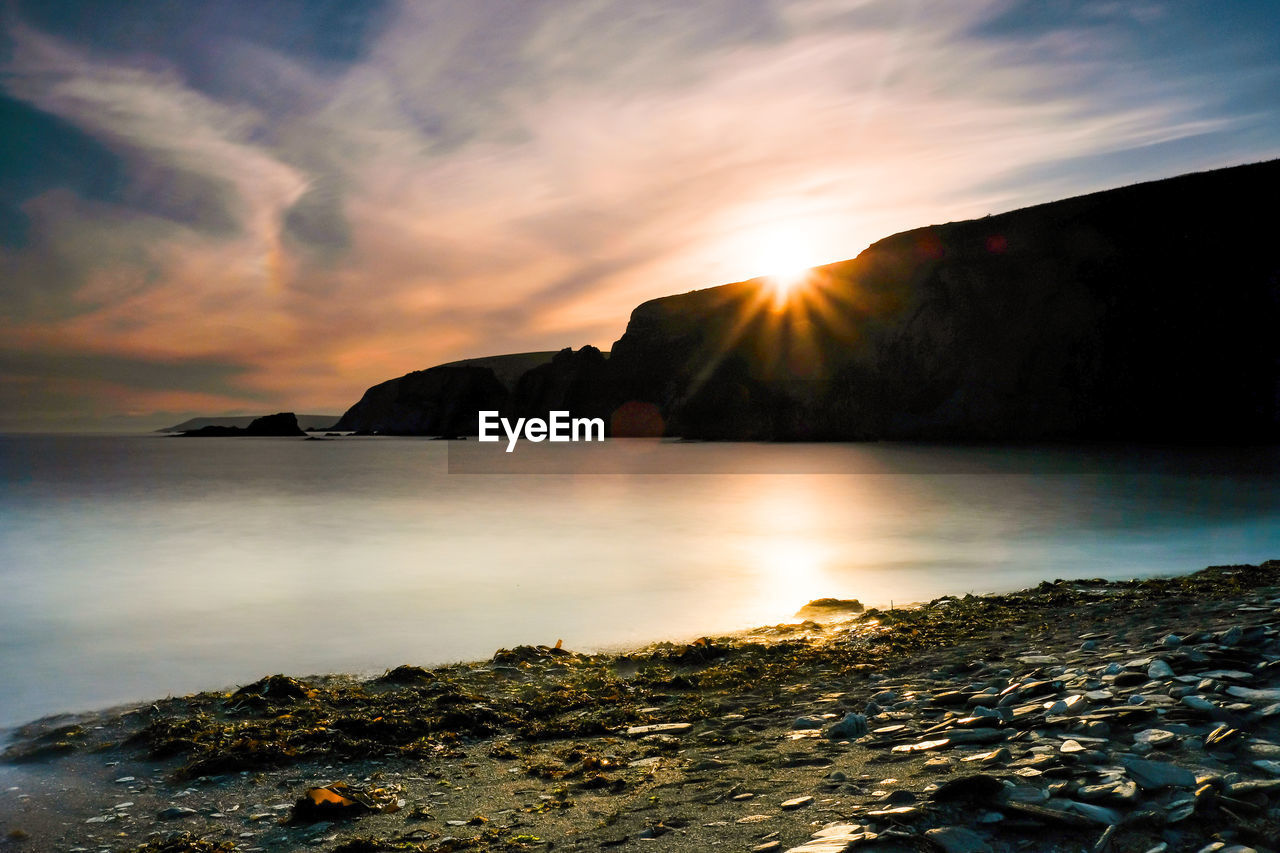 Scenic view of sea against sky during sunset