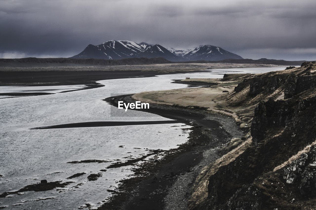 Scenic view of snowcapped mountains against sky