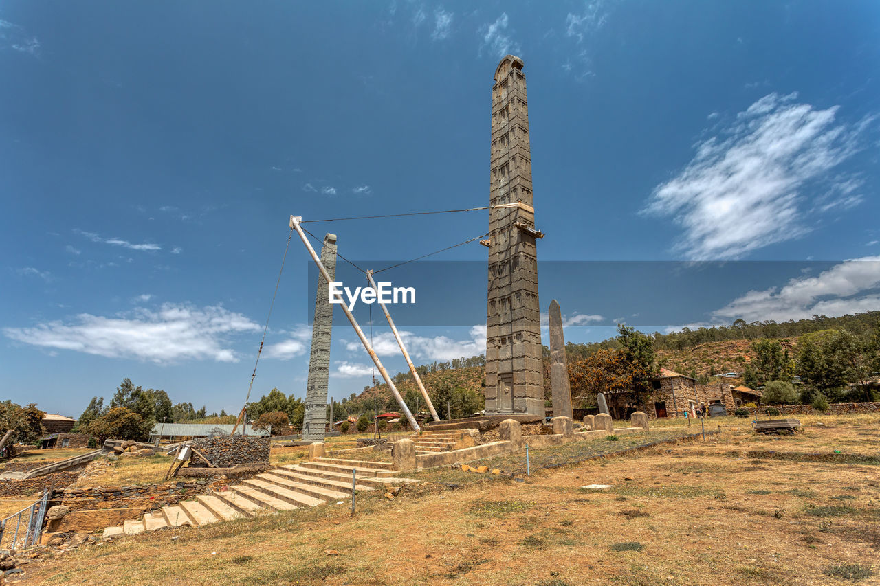 BUILT STRUCTURE ON LAND AGAINST SKY