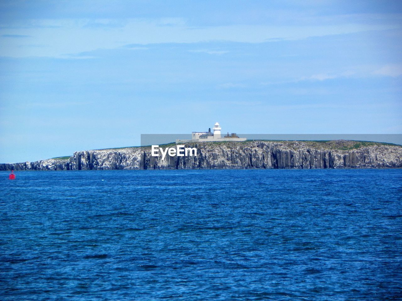 VIEW OF SEA AGAINST BLUE SKY