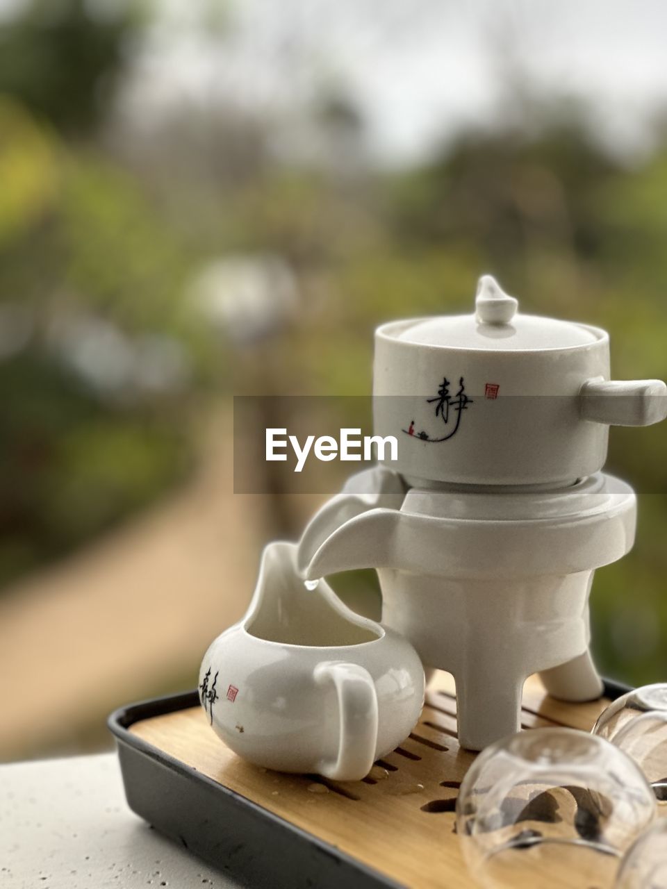 cup, drink, mug, teapot, food and drink, no people, focus on foreground, crockery, coffee cup, ceramic, tea, hot drink, tea cup, day, table, outdoors, refreshment, still life, tableware, nature, close-up