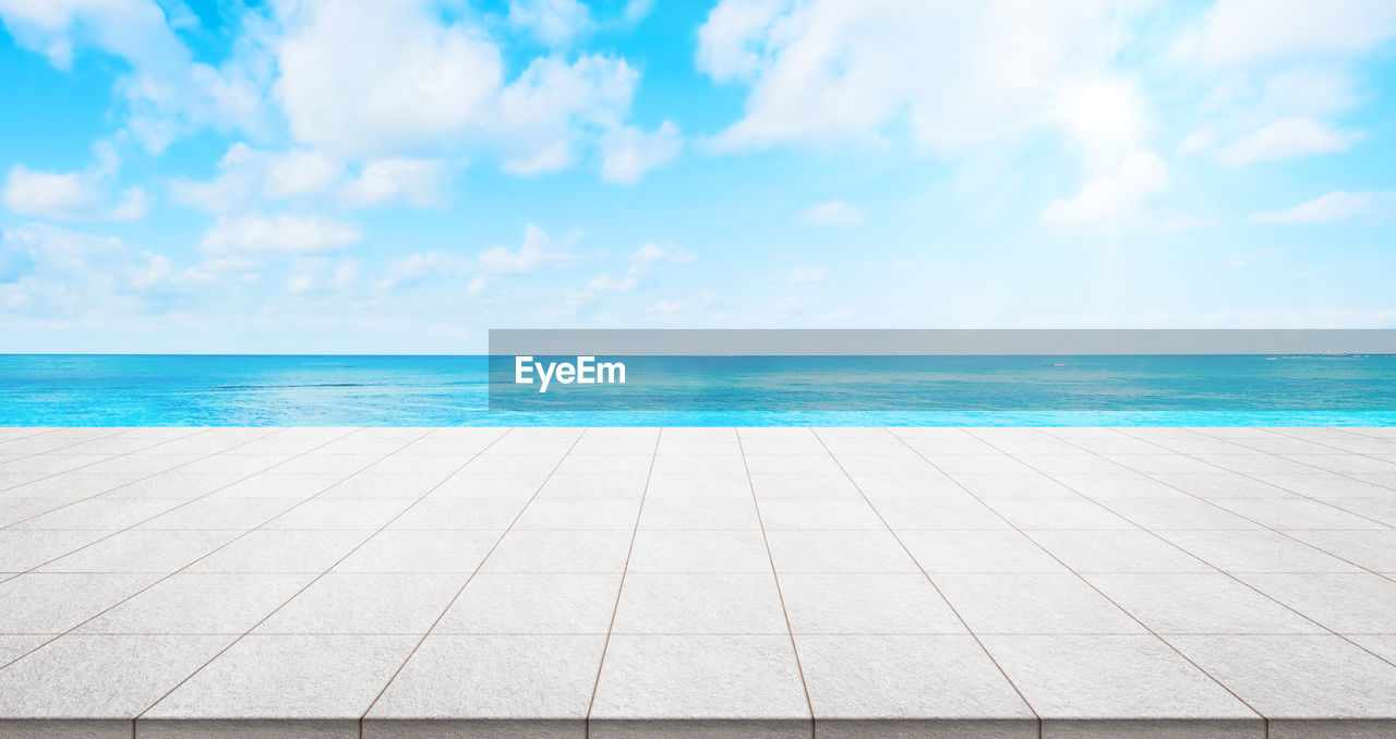 Scenic view of sea against blue sky