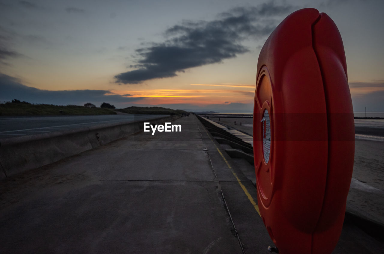 sky, sunset, cloud, transportation, nature, red, horizon, sea, no people, water, road, evening, mode of transportation, dusk, reflection, dramatic sky, outdoors, orange color, coast, scenics - nature, travel, beauty in nature, ocean, land, environment