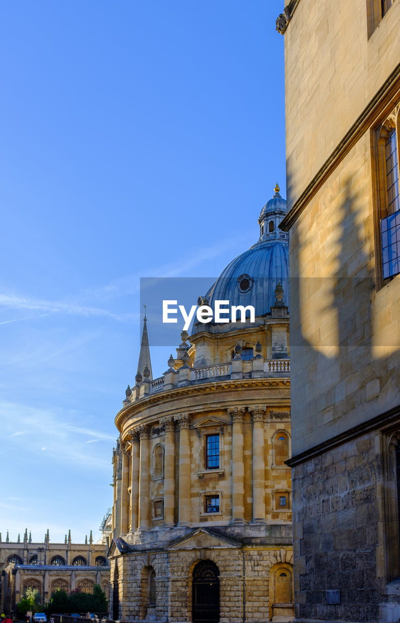 low angle view of historic building against blue sky