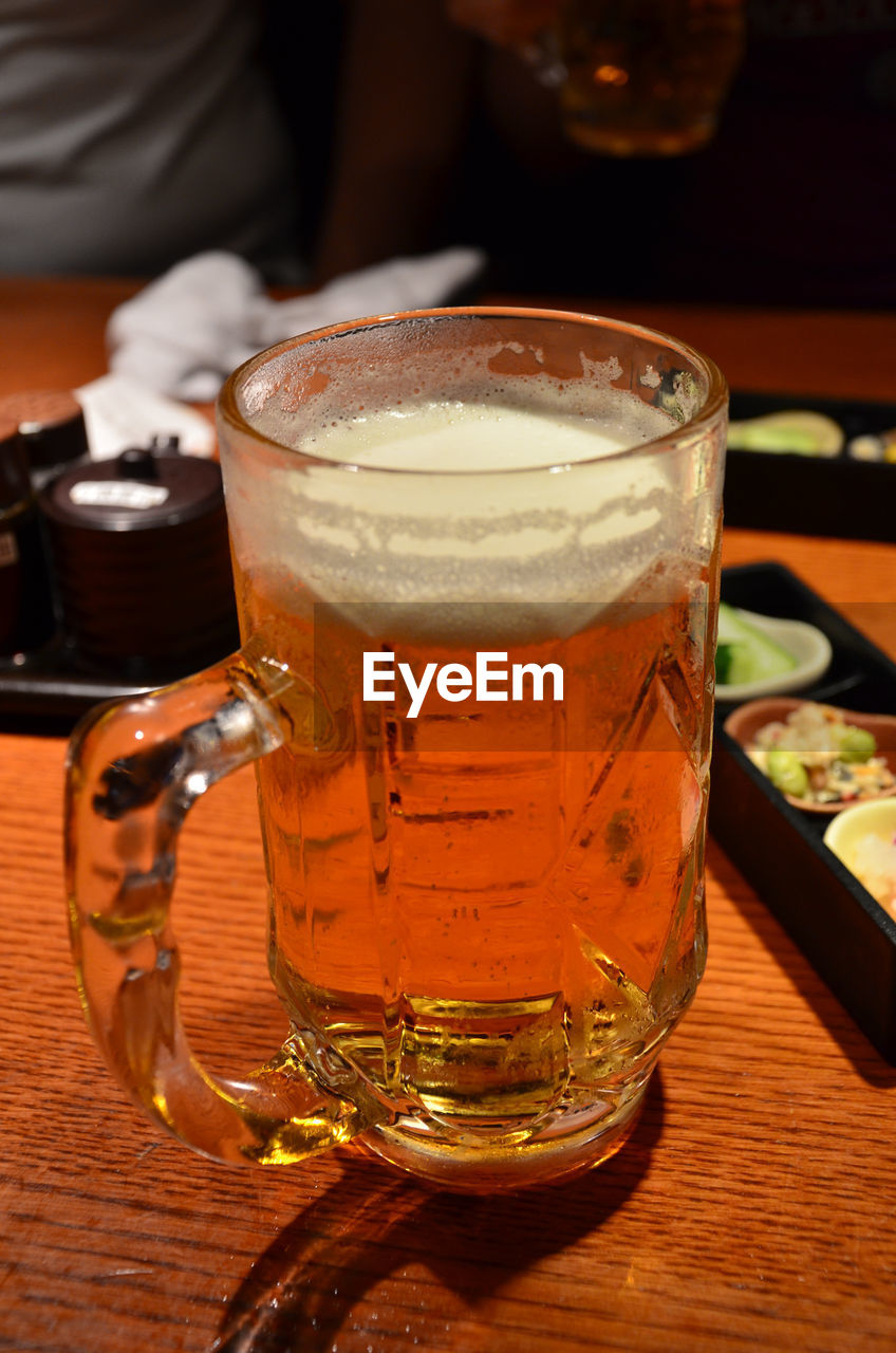 Close-up of beer glass on table