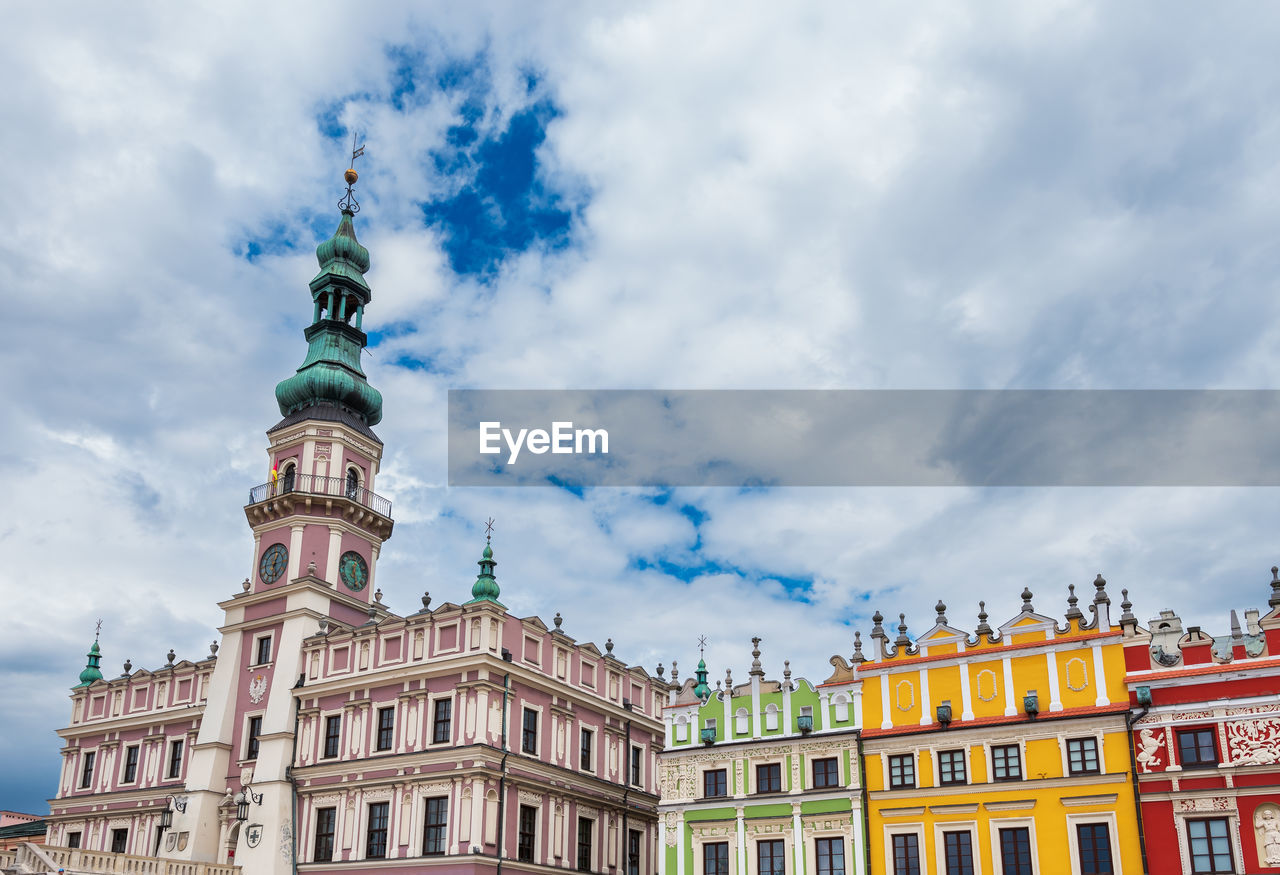  a beautiful renaissance town hall with multi-colored tenement houses. zamosc is an ideal city. 