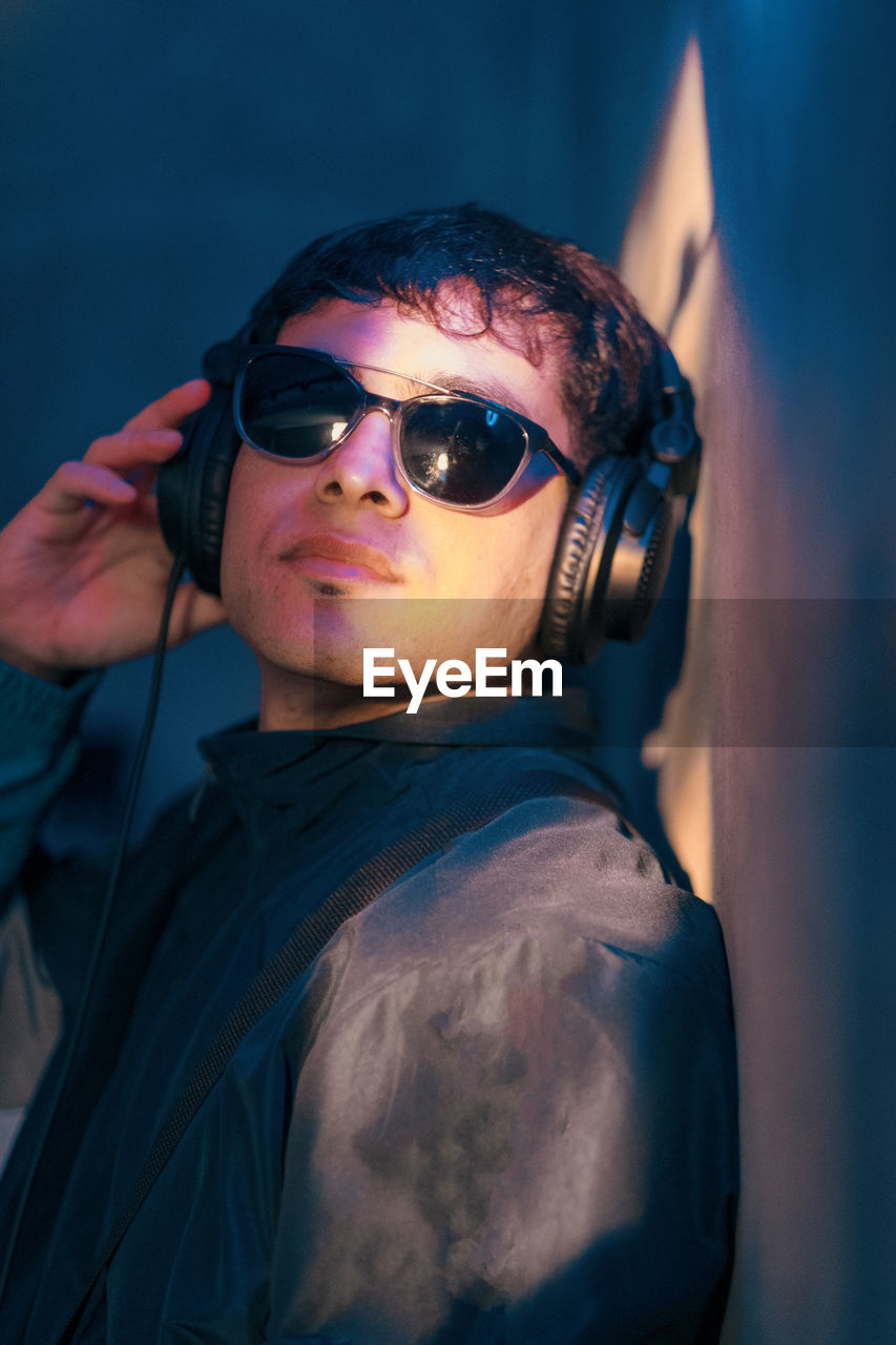 Handsome young man listening to music