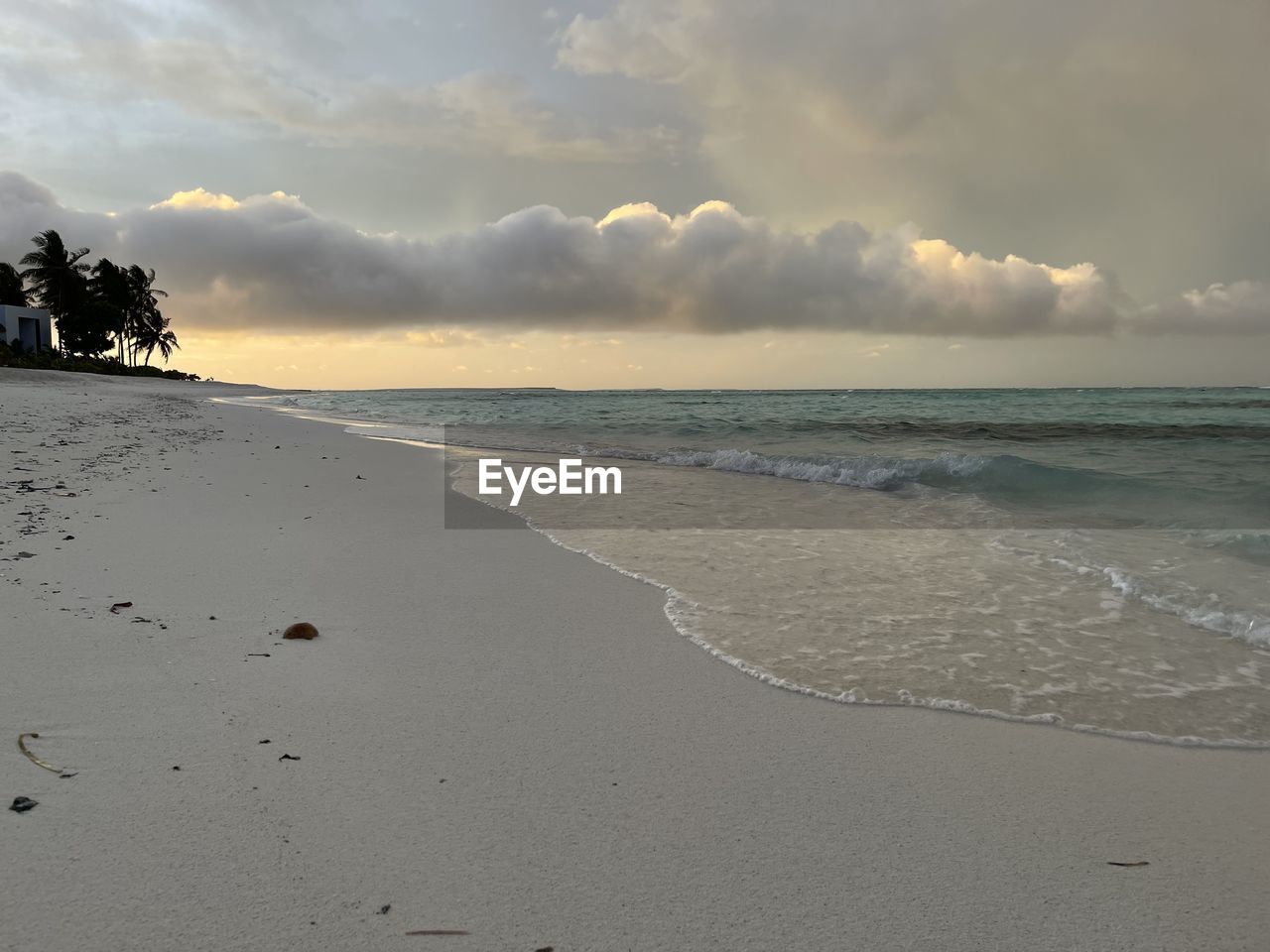 SCENIC VIEW OF BEACH DURING SUNSET