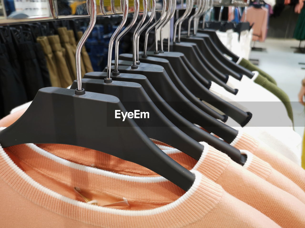 Clothes hanging on rack at store