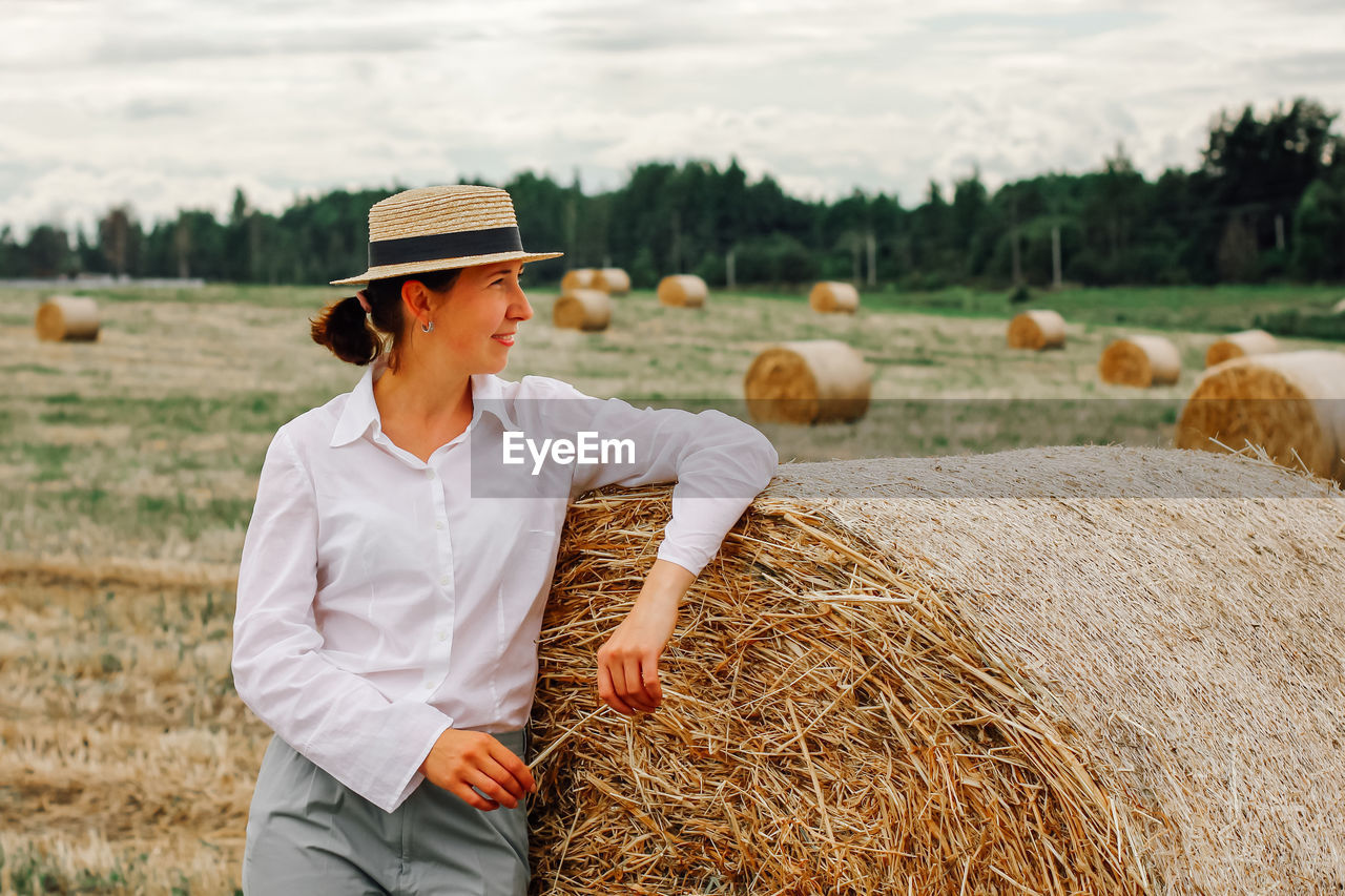 Round bales of straw rolled up on the field. hay harvesting for livestock, sowing, harvesting