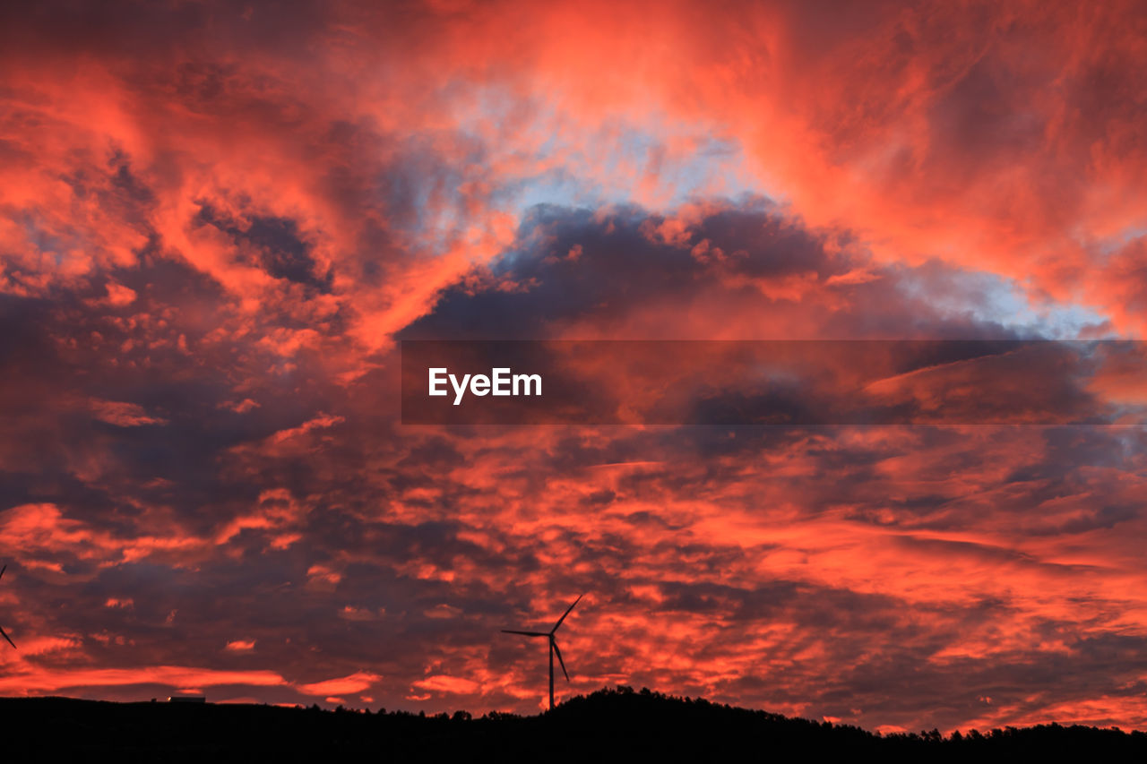 Group of windmills in mountain at sunrise