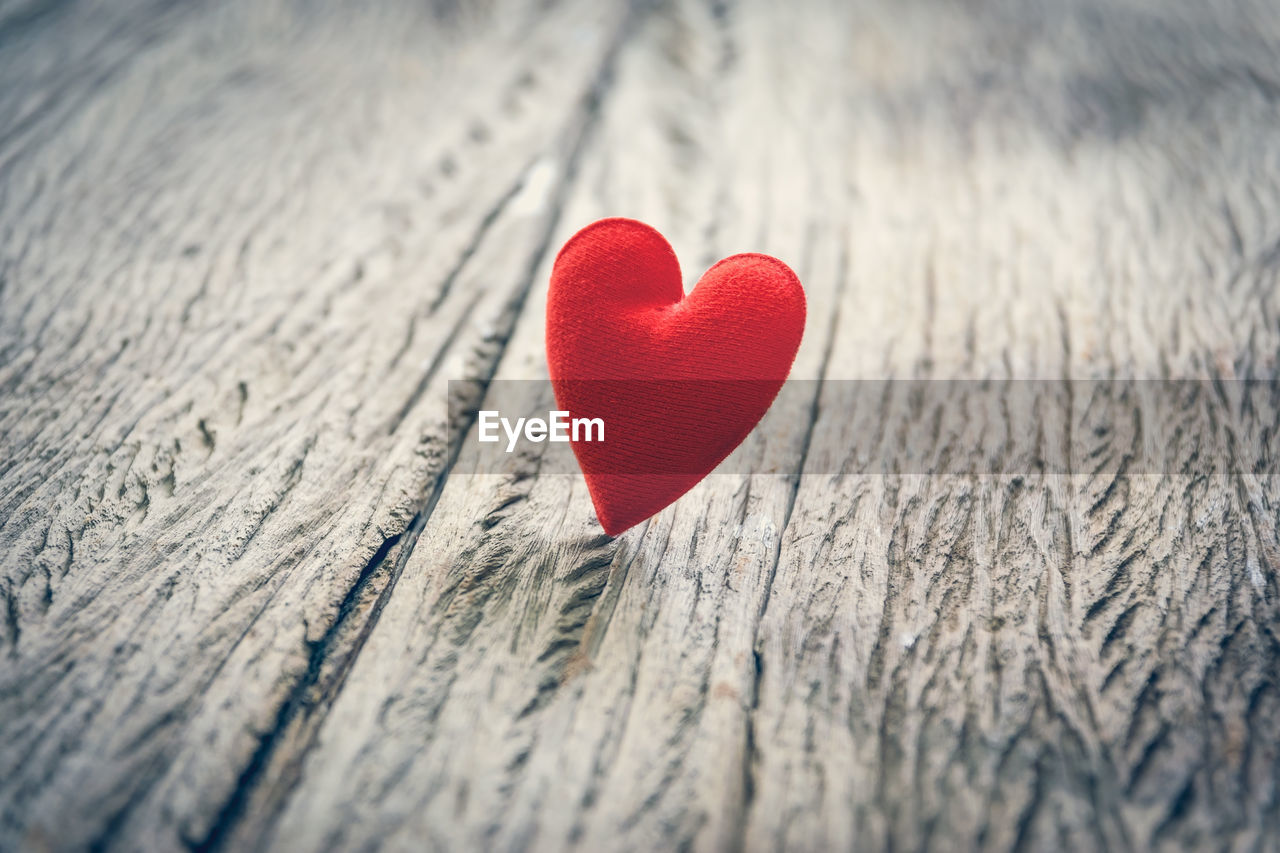 Close-up of red heart shape decoration on table