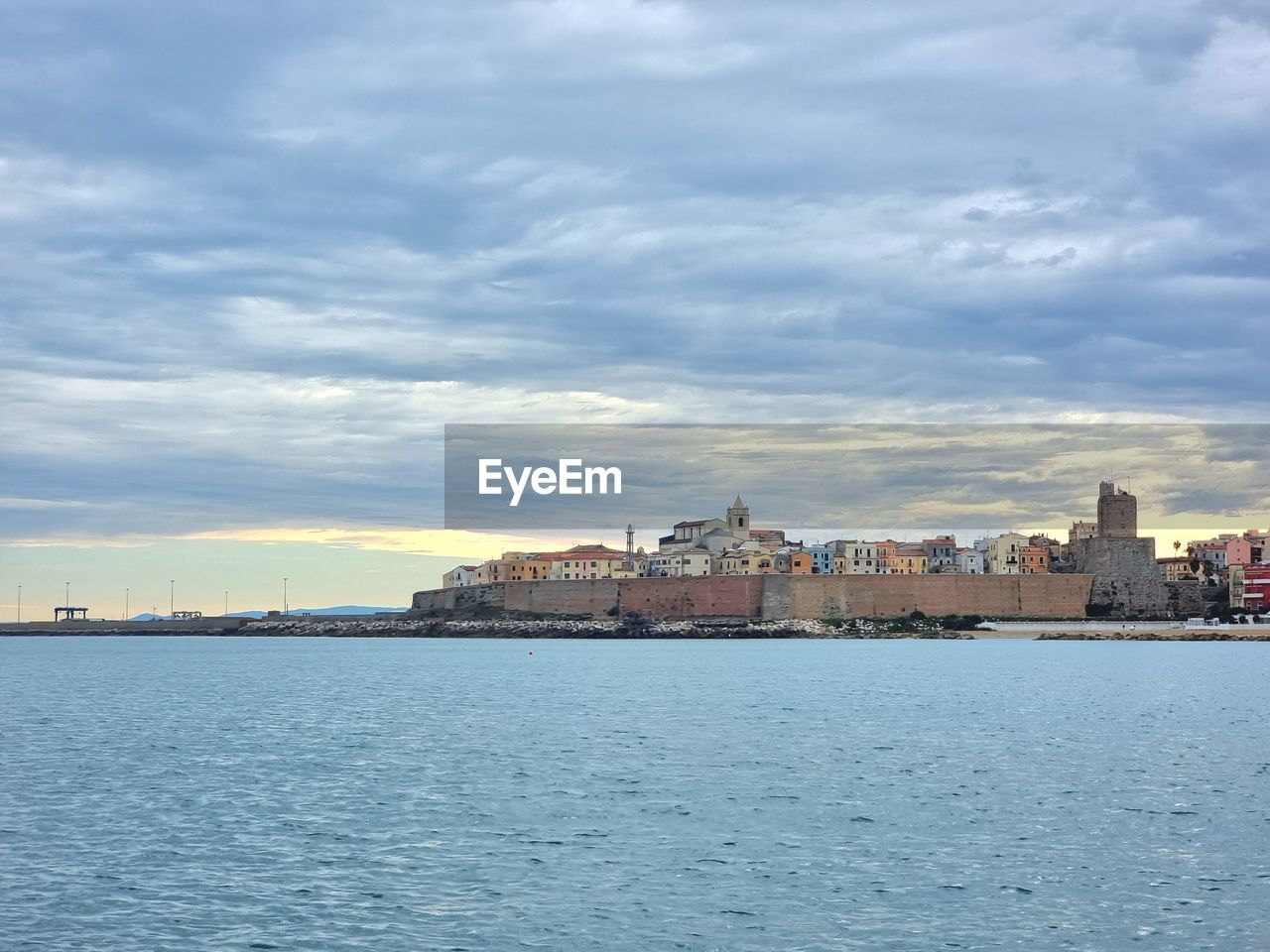 architecture, built structure, city, building exterior, water, sky, building, sea, cloud, horizon, travel destinations, cityscape, coast, harbor, nature, landscape, urban skyline, travel, bay, shore, waterfront, tourism, no people, vehicle, skyline, body of water, ocean, city life, outdoors, residential district, environment, land, the past, scenics - nature, town, transportation, history, day, house, beauty in nature, blue, dusk, reflection