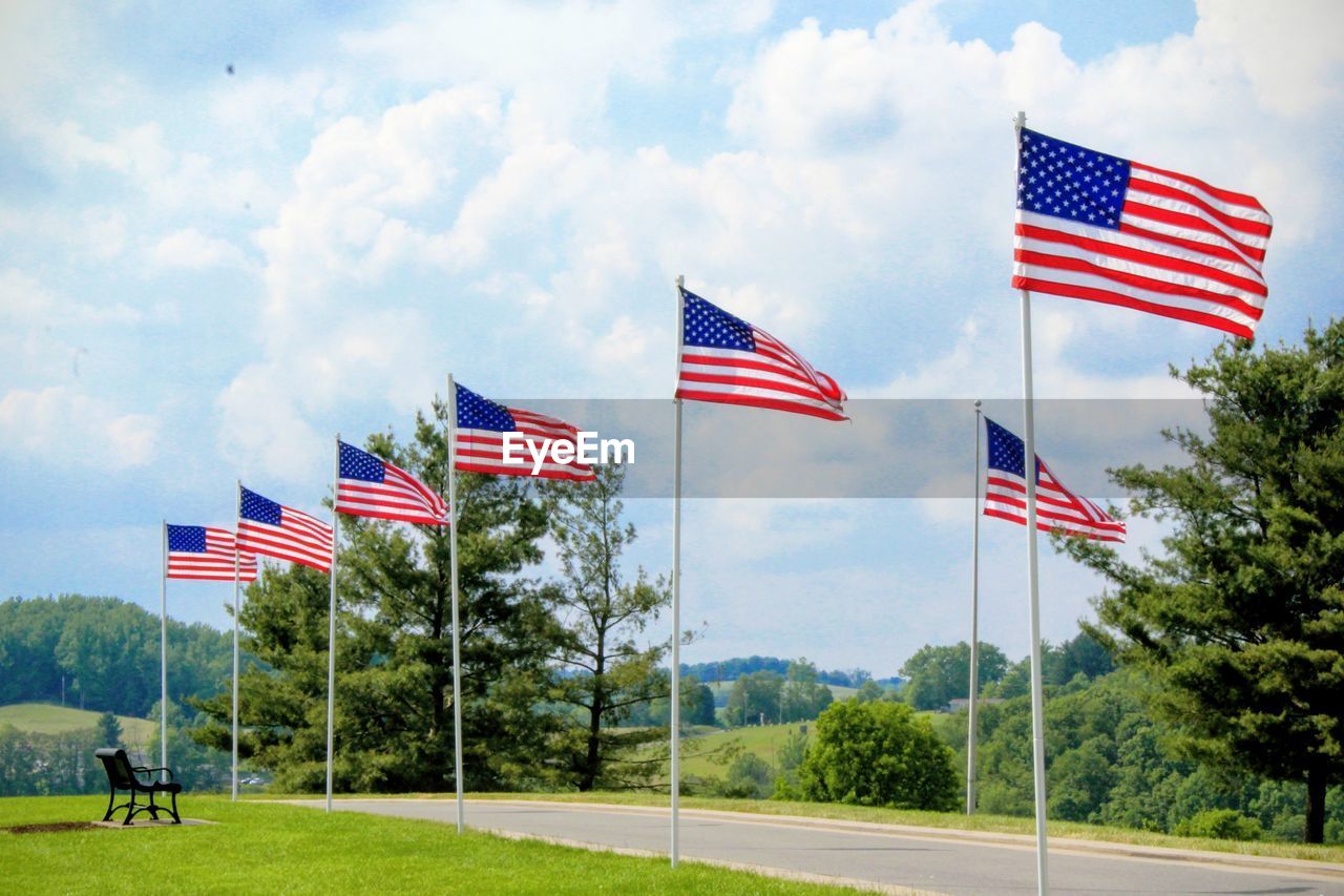 Low angle view of american flag against sky