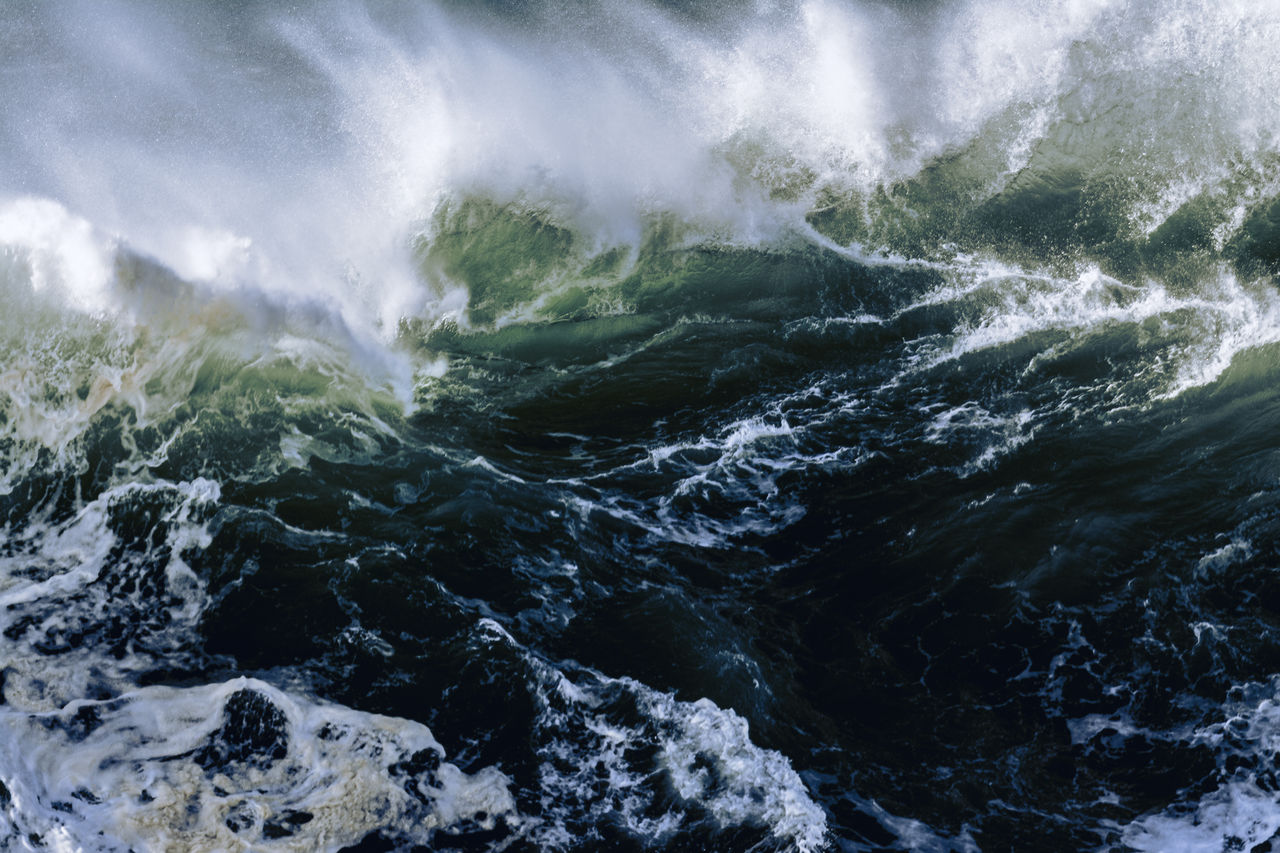 Big wave breaking at praia do norte, nazare