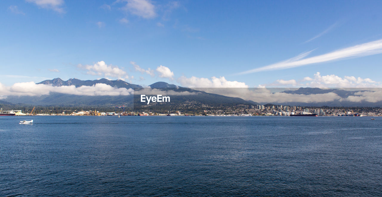 SEA BY CITY AGAINST SKY