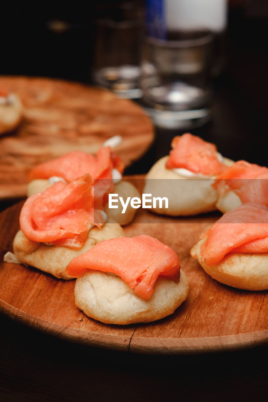 food and drink, food, freshness, meal, indoors, healthy eating, meat, breakfast, produce, dish, processed meat, no people, pork, fruit, slice, bread, wellbeing, wood, table, cutting board, ham, snack, cuisine, close-up, vegetable, focus on foreground