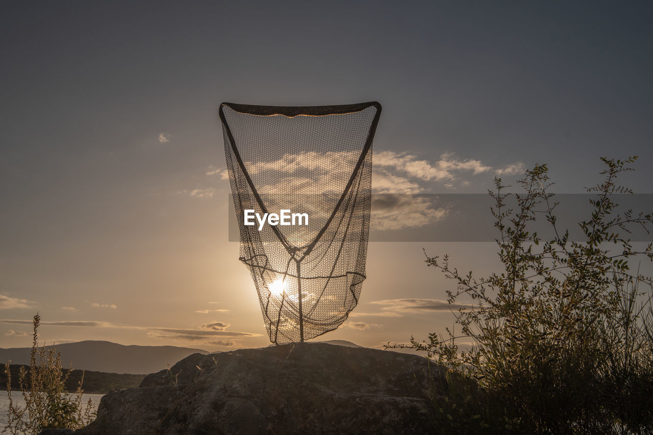 sky, nature, no people, sunset, cloud, reflection, evening, sunlight, beauty in nature, scenics - nature, light, tranquility, plant, tree, outdoors, mountain, silhouette, environment, land, landscape, dusk