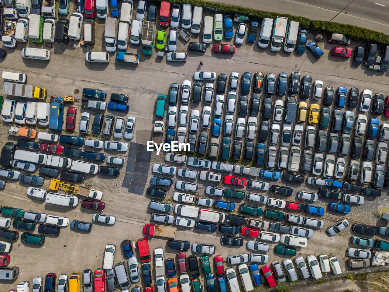 Aerial view of colorful cars parked on parking lot
