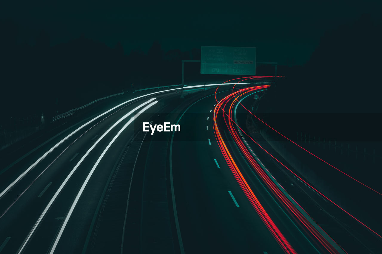 High angle view of light trails on road