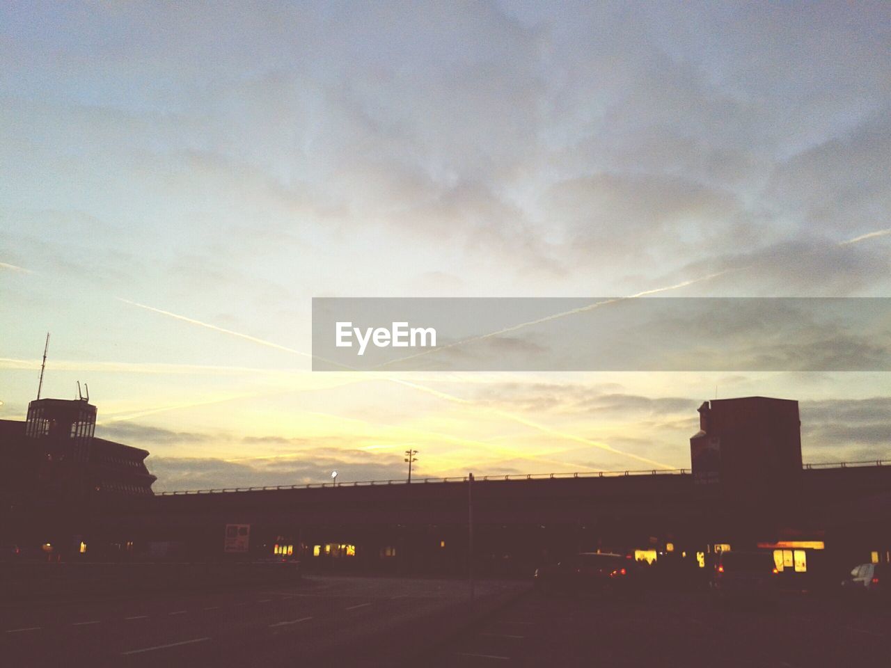 Silhouette of built structure at sunset