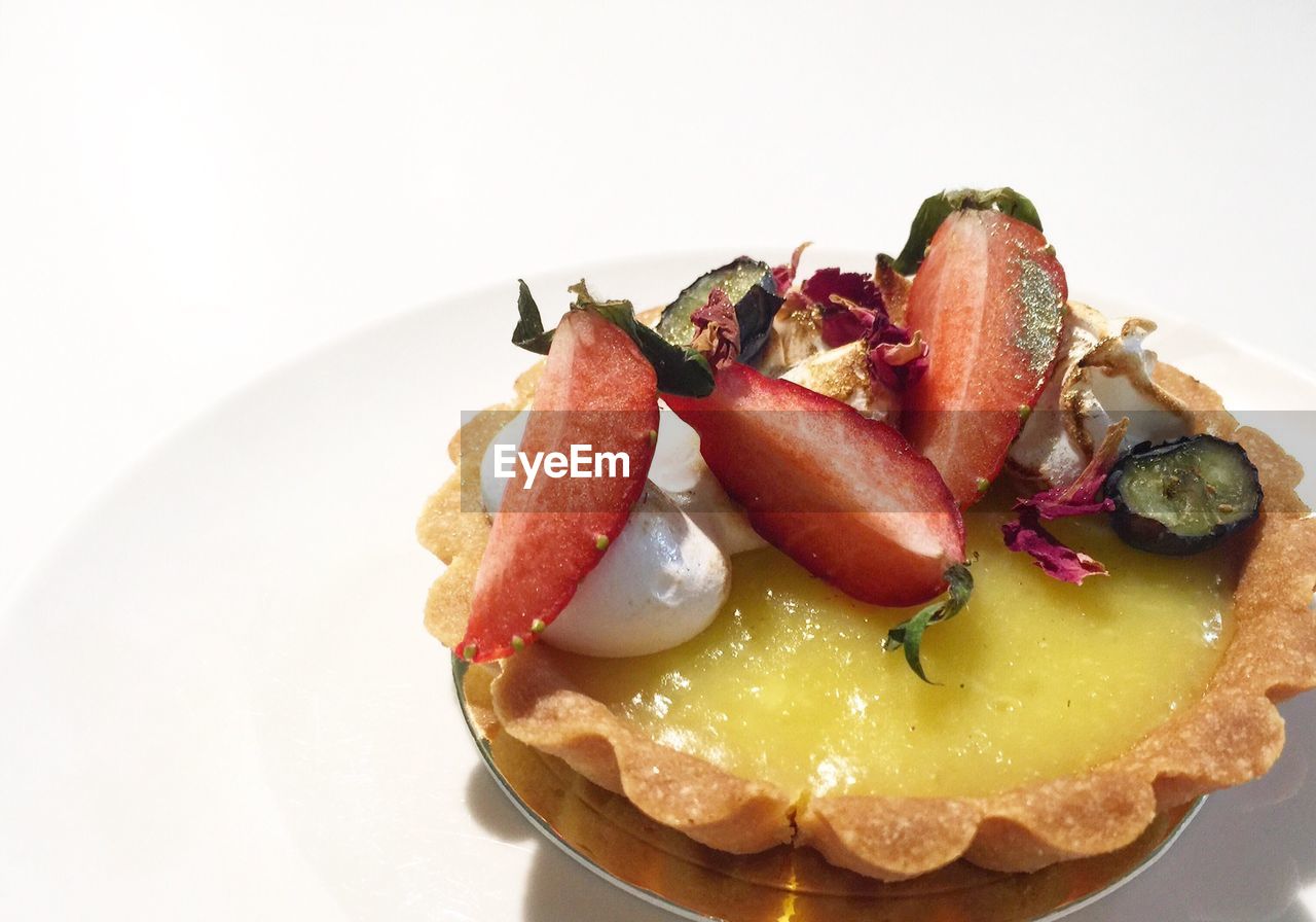 Close-up of food in plate on white background