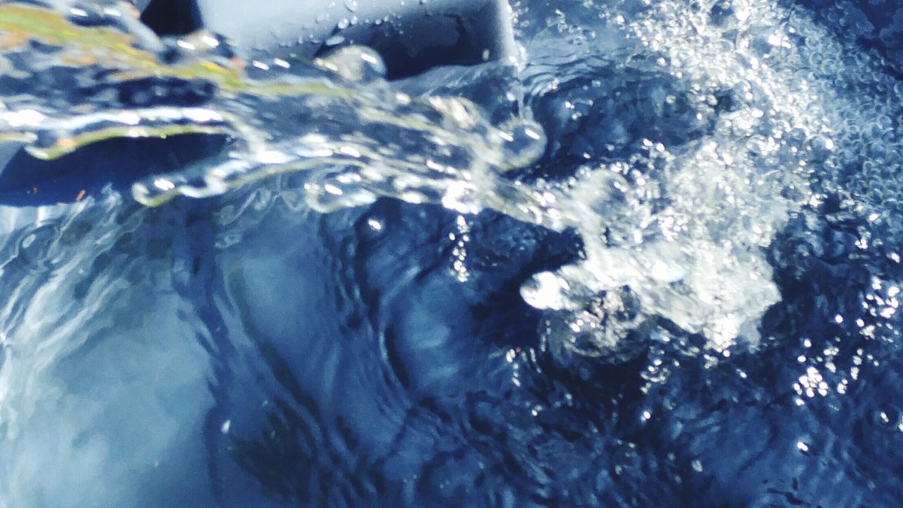 CLOSE-UP OF WATER SPLASHING IN WATER