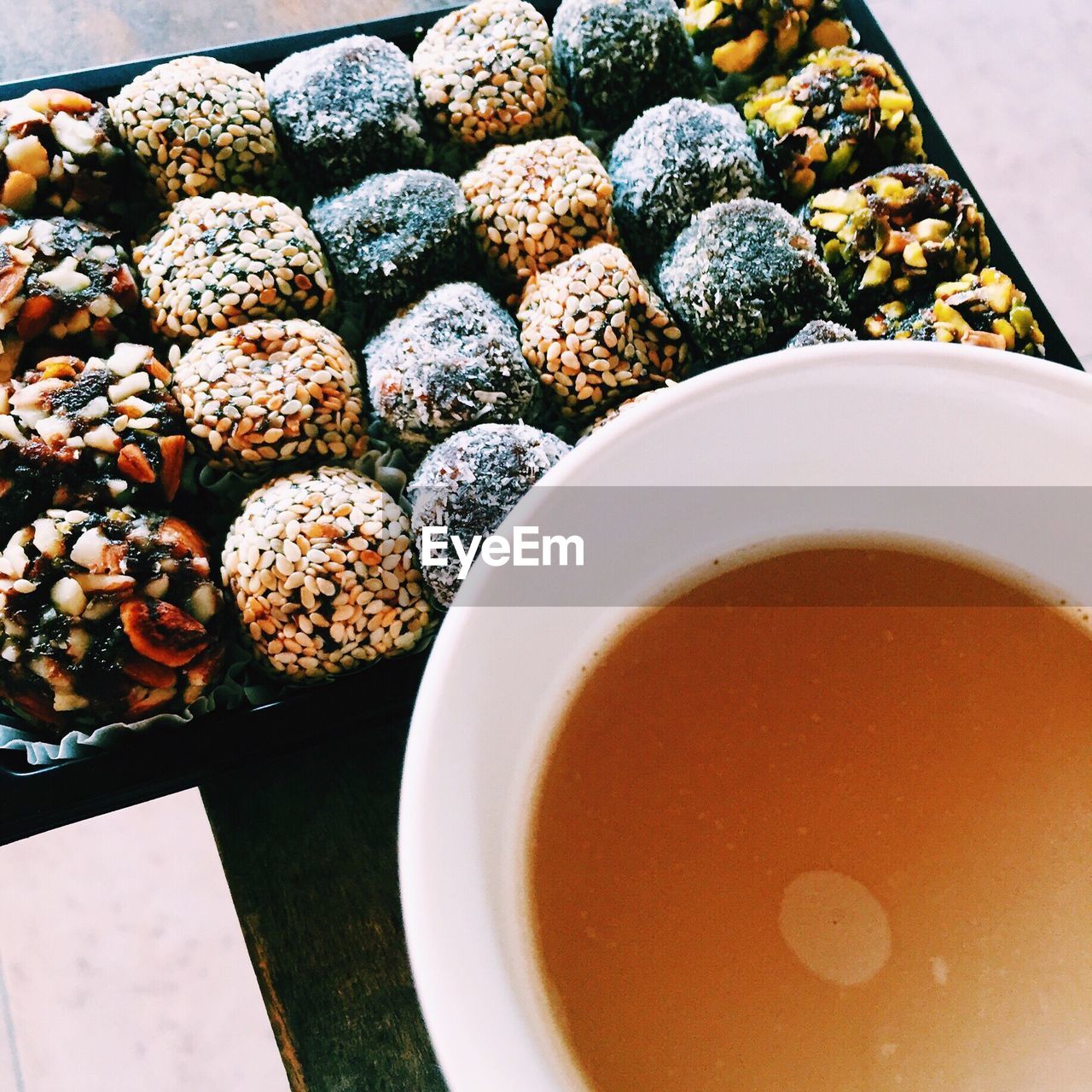 Close-up of tea and cookies on table