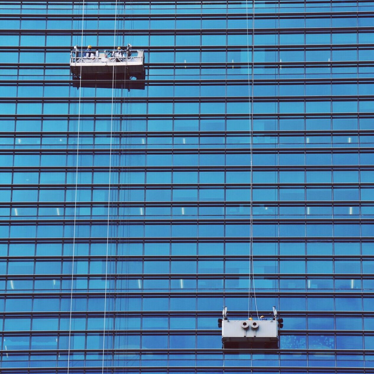 VIEW OF BUILDING AGAINST BLUE WINDOW