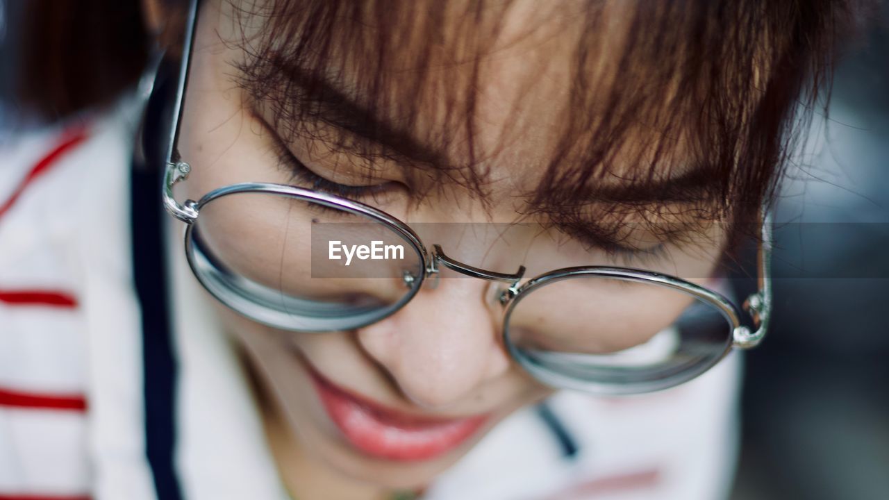 Close-up of woman wearing eyeglasses