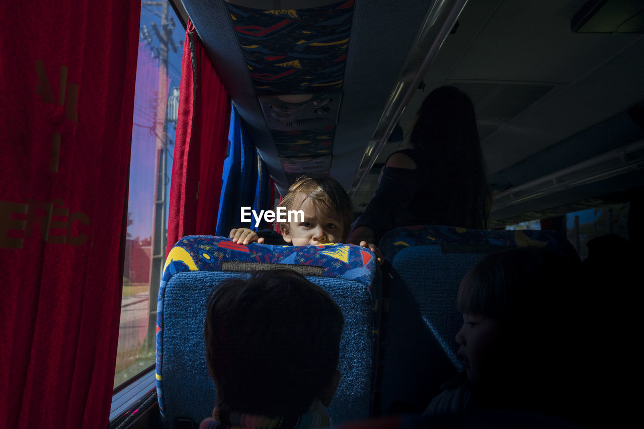 Portrait of boy traveling in bus