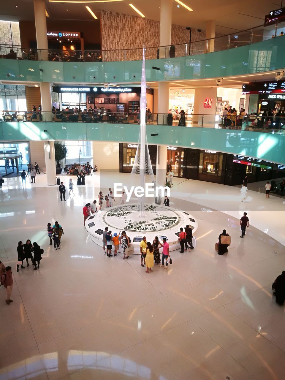 HIGH ANGLE VIEW OF PEOPLE ON SHOPPING MALL