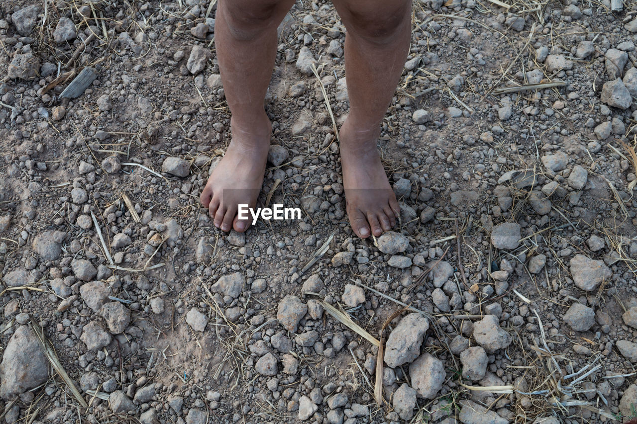 Low section of child standing on ground