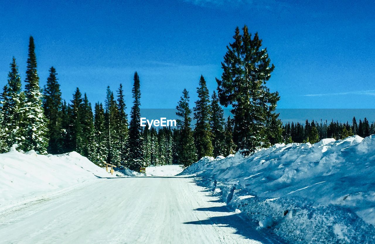 Scenic view of snow covered mountains against sky