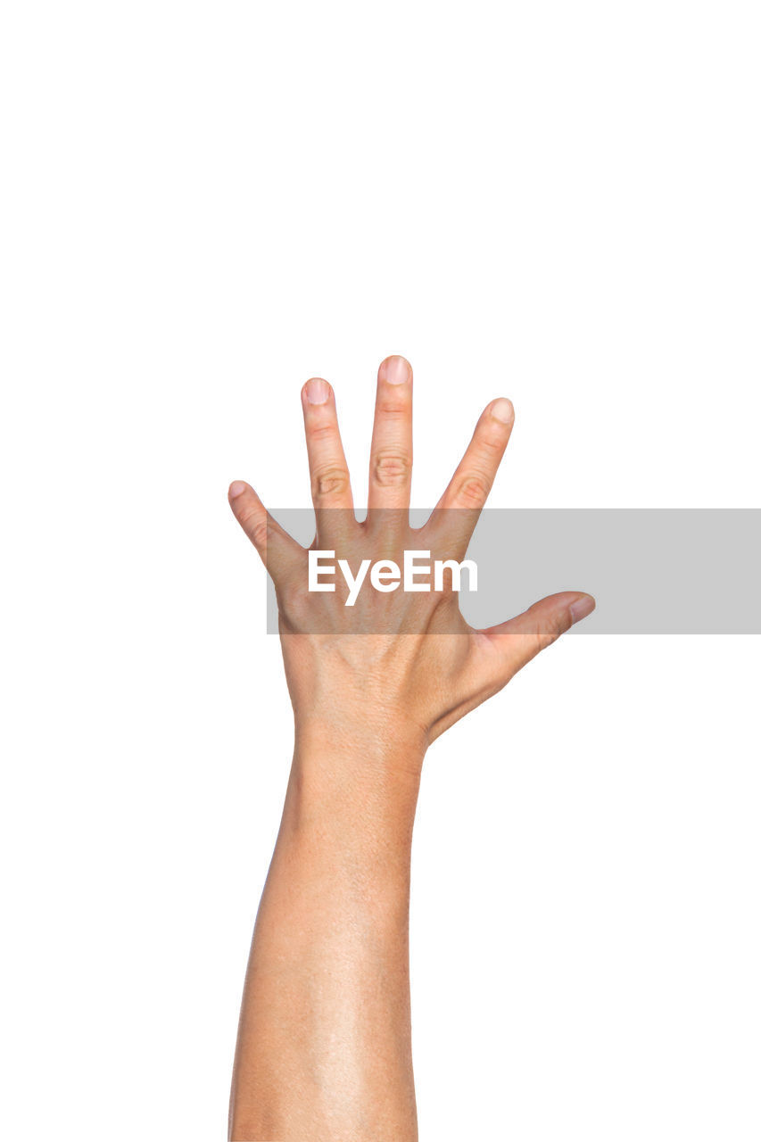 Close-up of cropped hand gesturing against white background